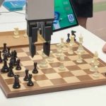 Chess-playing robot grabs and breaks finger